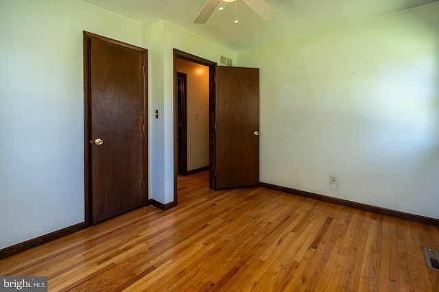 unfurnished bedroom featuring light wood-type flooring and ceiling fan