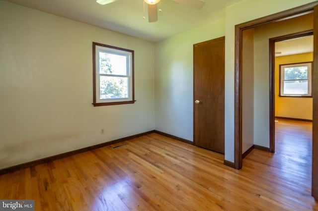 unfurnished bedroom featuring ceiling fan and light wood-type flooring