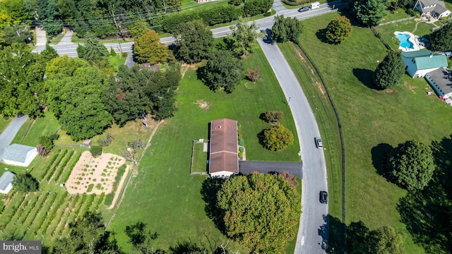 birds eye view of property with a rural view