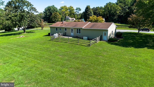 back of house featuring a yard