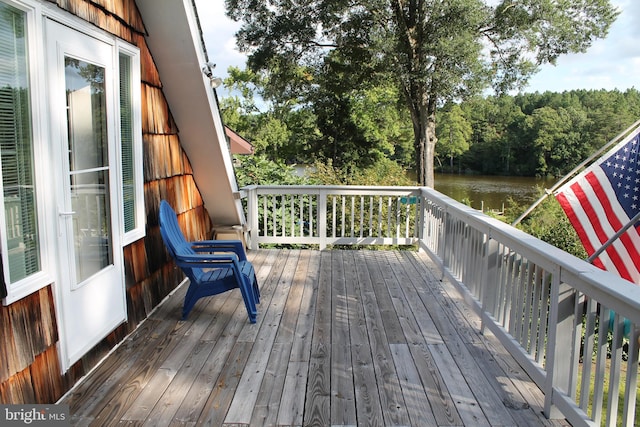 deck featuring a water view