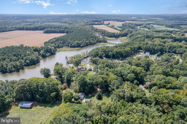 aerial view with a forest view and a water view