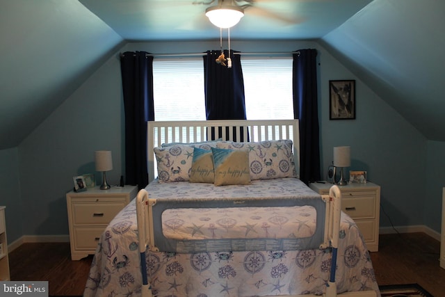 bedroom featuring a ceiling fan, vaulted ceiling, baseboards, and dark wood-style flooring