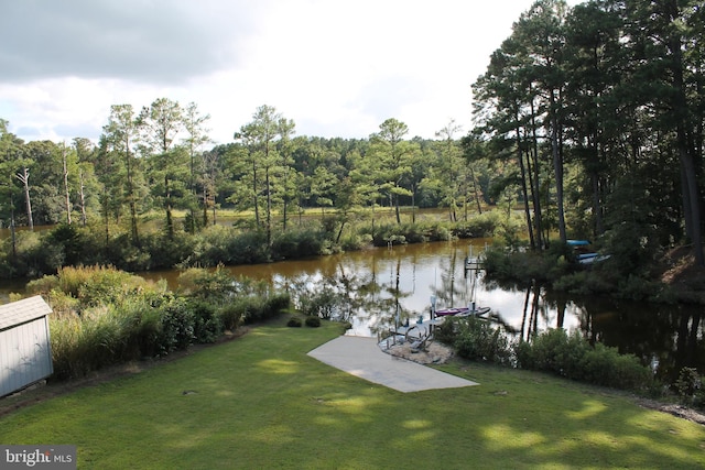 exterior space featuring a water view and a boat dock