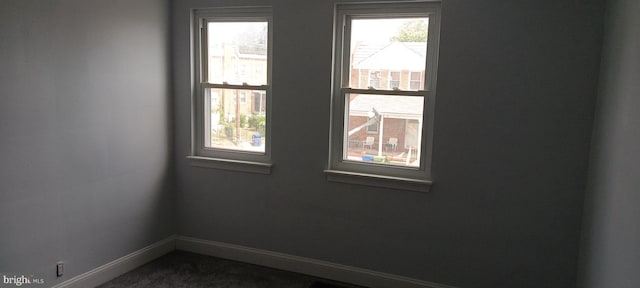 spare room featuring a wealth of natural light