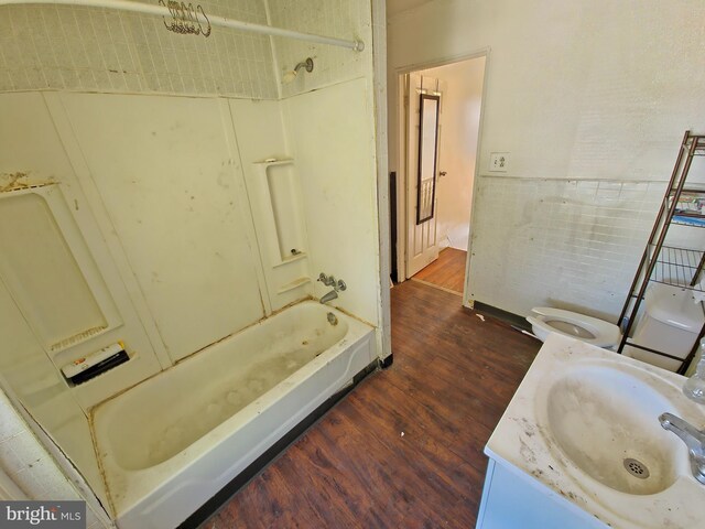 full bathroom featuring vanity, toilet, shower / bathtub combination, and hardwood / wood-style flooring