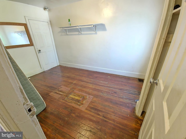 spacious closet featuring visible vents and hardwood / wood-style flooring