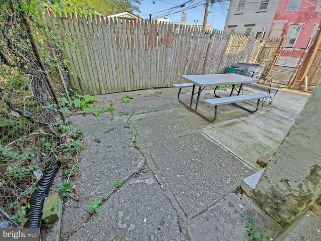 view of patio with a fenced backyard and outdoor dining space