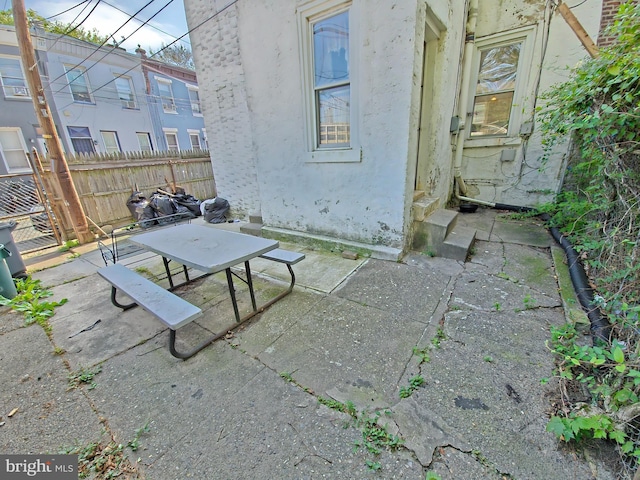 view of patio / terrace with outdoor dining area and fence