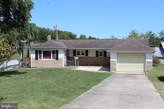 ranch-style house featuring a front yard and a garage