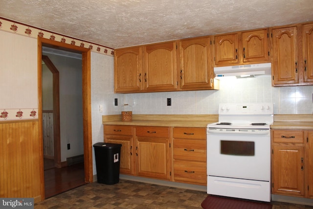 kitchen with under cabinet range hood, light countertops, brown cabinets, white range with electric stovetop, and a textured ceiling