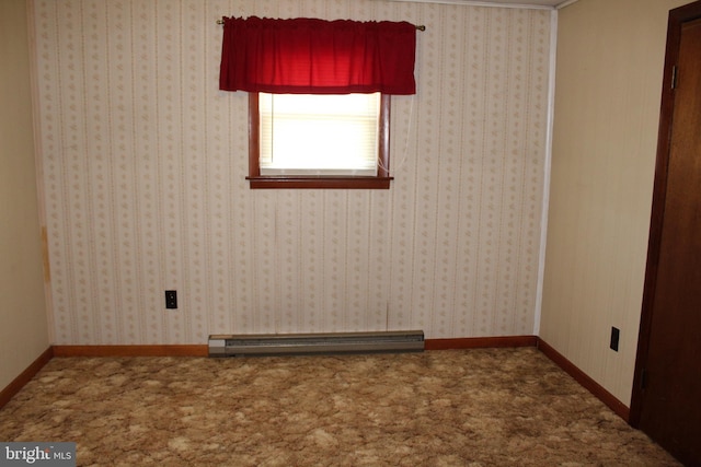 carpeted empty room with baseboard heating