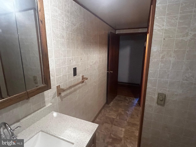 bathroom featuring tile walls and vanity