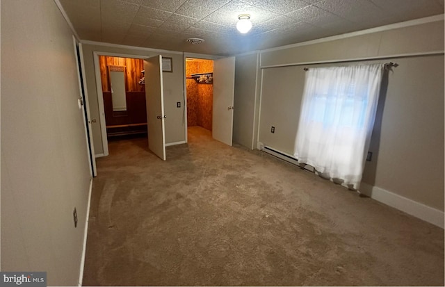 unfurnished bedroom with carpet flooring, visible vents, and baseboards