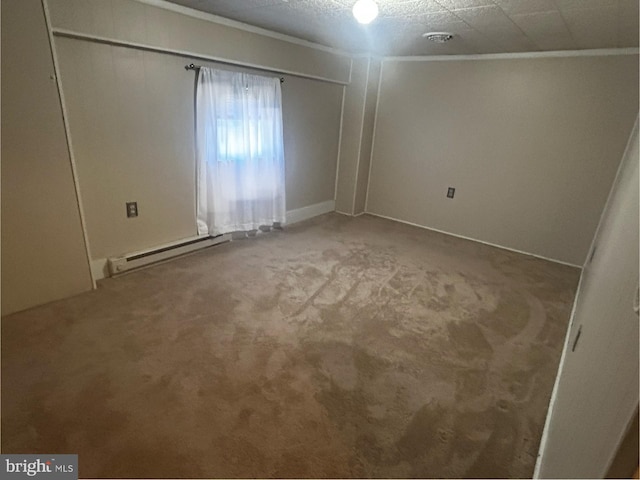 unfurnished room featuring a baseboard radiator and carpet floors