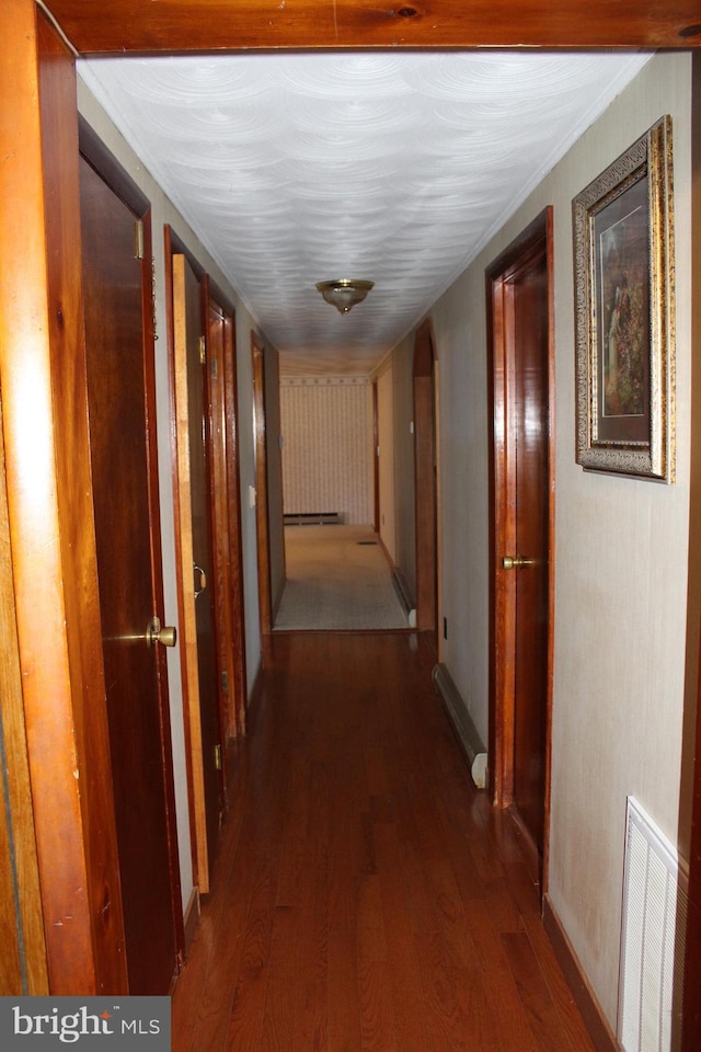 corridor featuring dark wood-type flooring