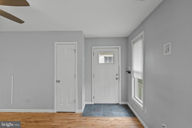 entryway with hardwood / wood-style floors, ceiling fan, and a wealth of natural light