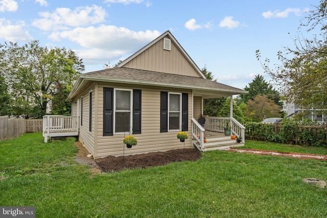 bungalow-style house with a front yard