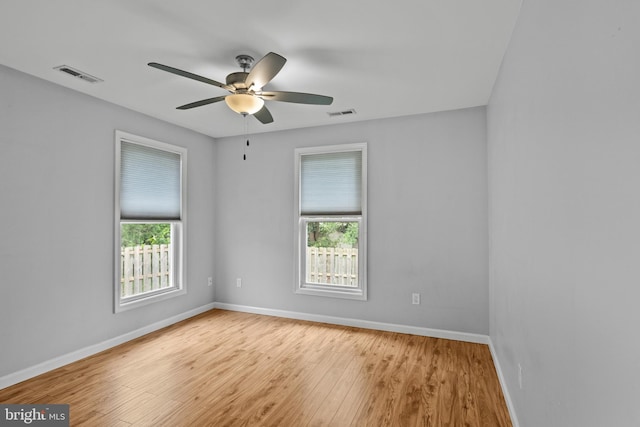 unfurnished room with light hardwood / wood-style floors and ceiling fan