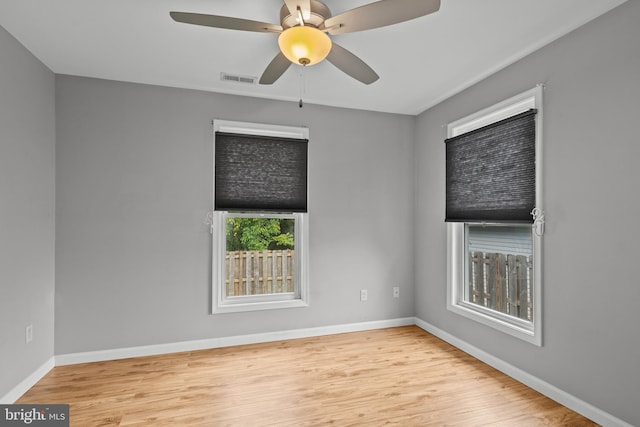 empty room featuring ceiling fan and light hardwood / wood-style flooring