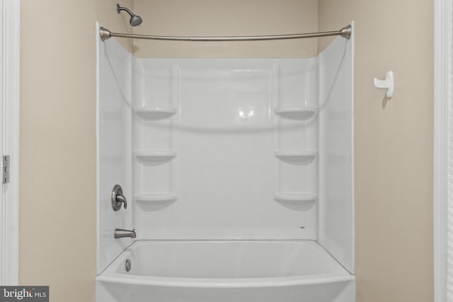 bathroom with bathing tub / shower combination