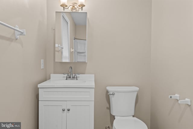 bathroom with vanity and toilet