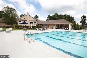 community pool featuring a patio area