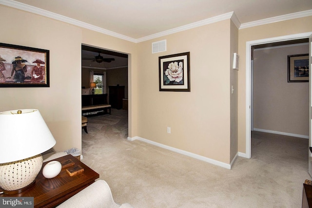 corridor featuring visible vents, carpet floors, baseboards, and crown molding