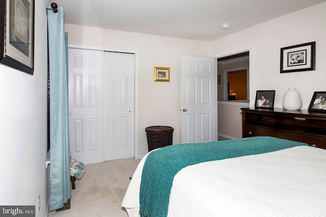 bedroom featuring a closet and carpet floors