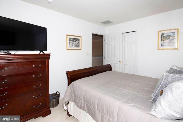 carpeted bedroom with a closet