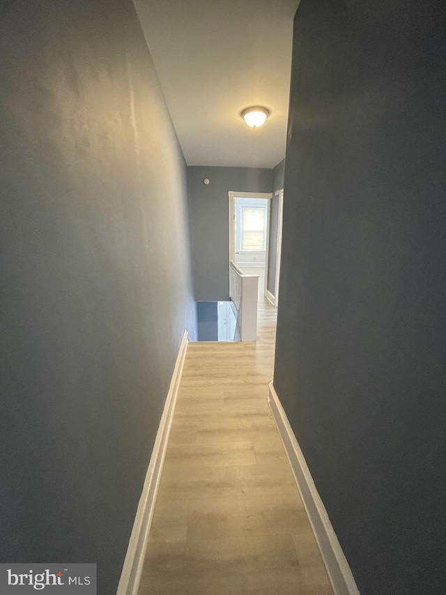 corridor featuring wood-type flooring