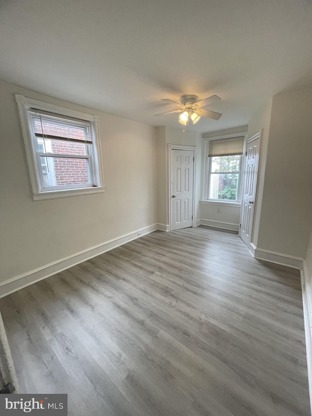 spare room featuring hardwood / wood-style floors, ceiling fan, and a textured ceiling