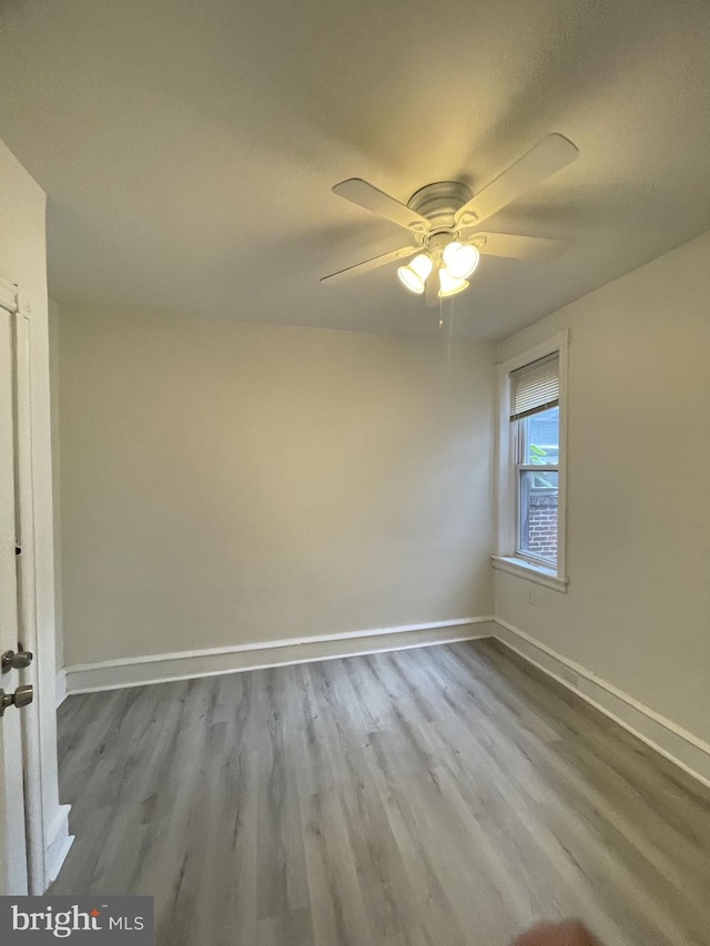 unfurnished room featuring a textured ceiling, ceiling fan, and wood-type flooring