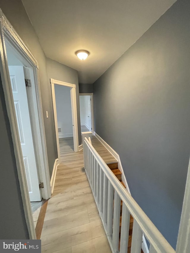 corridor featuring light wood-type flooring