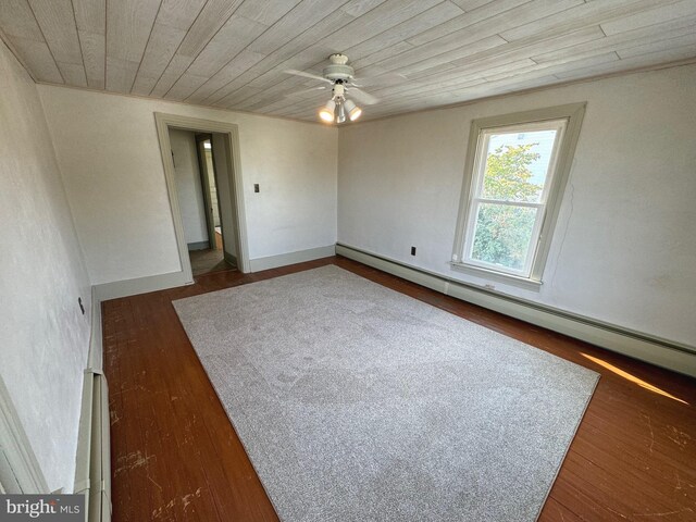 empty room with wood-type flooring, ceiling fan, and a wealth of natural light