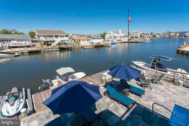 view of patio with a water view