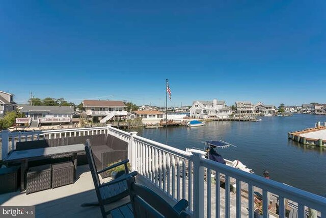 wooden deck with a water view