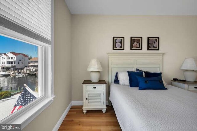 bedroom featuring ceiling fan and light hardwood / wood-style floors