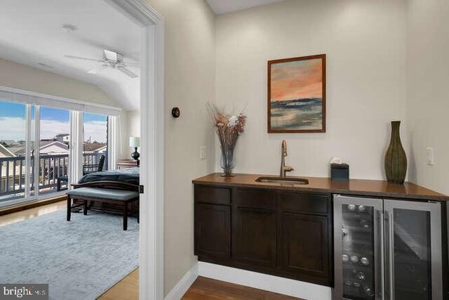 hallway featuring vaulted ceiling, a wealth of natural light, and light hardwood / wood-style floors