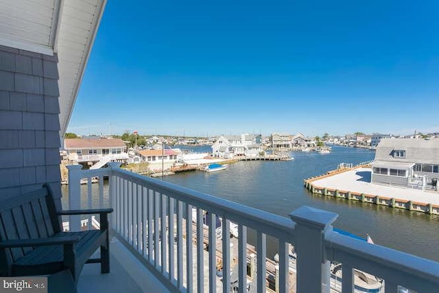 balcony featuring a water view