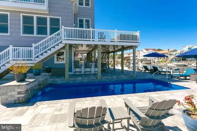 view of swimming pool featuring a patio