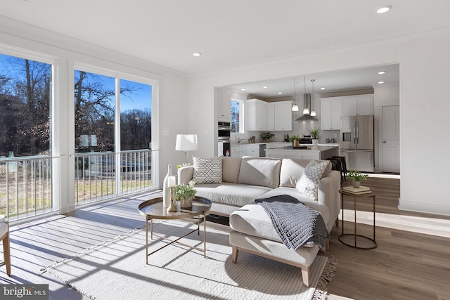 1333 German Driveway, Hanover, MD 21076 - living room with healthy amount of natural light, light wood-style flooring, recessed lighting, and crown molding