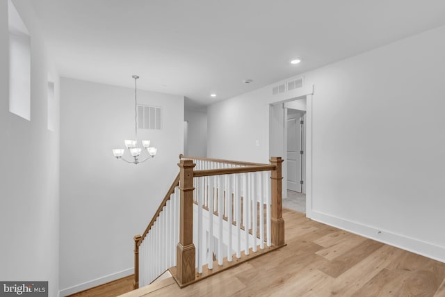 1333 German Driveway, Hanover, MD 21076 - hall featuring a chandelier, an upstairs landing, light wood-type flooring, and recessed lighting