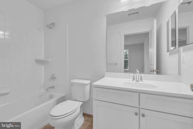 full bathroom featuring tile patterned floors, toilet, vanity, and tiled shower / bath