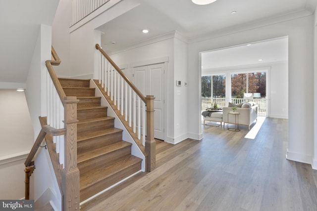 1333 German Driveway, Hanover, MD 21076 - stairs featuring wood finished floors, ornamental molding, and recessed lighting