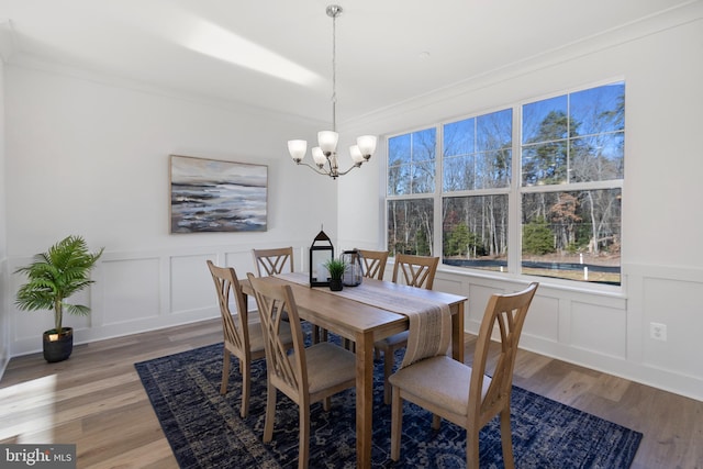 1333 German Driveway, Hanover, MD 21076 - dining room with a decorative wall, a chandelier, light wood-type flooring, crown molding, and wainscoting