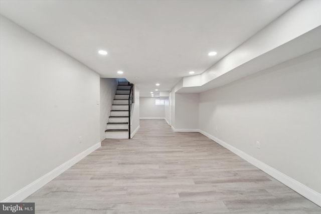 basement featuring light wood-type flooring