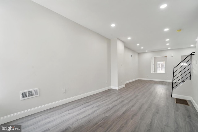 basement featuring hardwood / wood-style floors