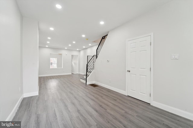 basement with hardwood / wood-style floors