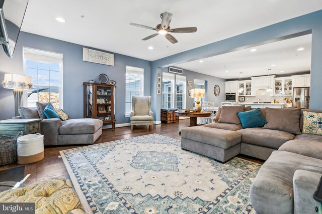 living room with recessed lighting, wood finished floors, and baseboards